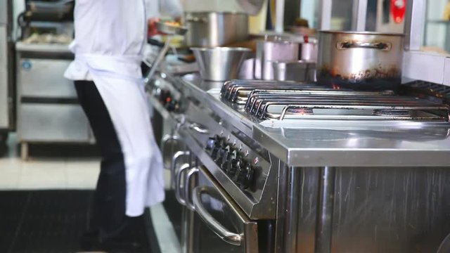 Chef prepare ingredient and cooking food in kitchen
