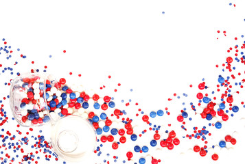 patriotism, independence day USA, Russia, France, Serbia, confetti and candy white-blue-red in a glass jar on a white background, isolate