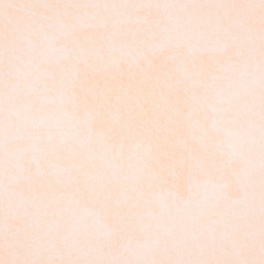 Beige scratched background with spots of paint. 