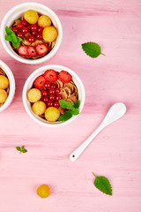 ..Healthy breakfast on white bowls.