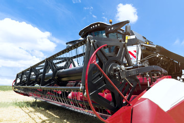 Fototapeta premium Combine harvester draper head. Agriculture heavy machinery
