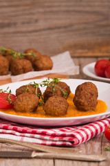 Meatballs with carrot purée.