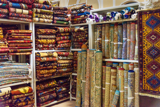 Heap of carpets on shop in Yazd. Iran