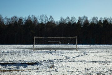 Empty football field in winter
