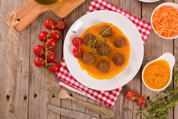 Meatballs with carrot purée.