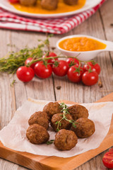 Meatballs with carrot purée.