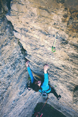 The woman is on a rock.