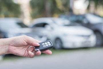 Road safety and car parking service business concept with people giving car key in parking lot
