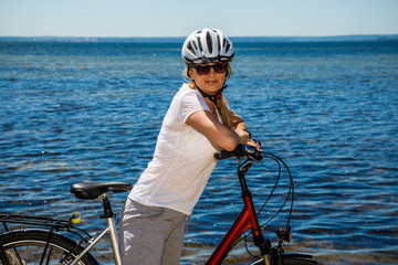 Healthy lifestyle - middle-aged woman riding bicycles