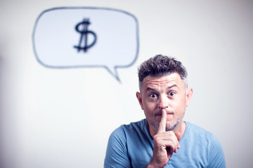 Portrait of a young man with a speech bubble dollar signe over his head