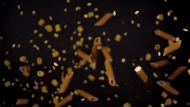 Italian penne frozen in mid-air. Shooted in super slow motion