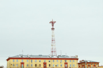Television radio tower in the center of the city among residential buildings. City. Panorama. Russia, Izhevsk, 2018.
