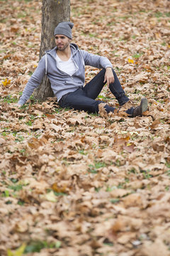 man in nature .autumn leaves.copy space