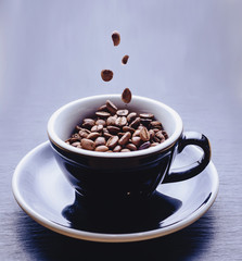 coffee beans falling to cup