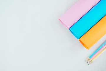 Color paper rolled and pencel on table for art.