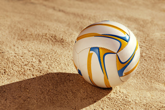 white ball on sand