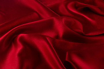 Naklejka na ściany i meble Abstract silk luxury background, piece of cloth, deep red cloth texture