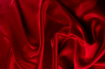 Abstract silk luxury background, piece of cloth, deep red cloth texture