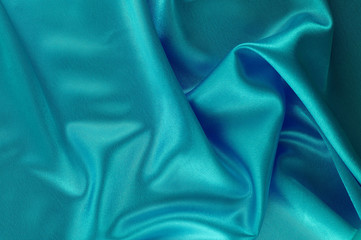 Abstract silk luxury background, piece of cloth, deep sea blue cloth texture