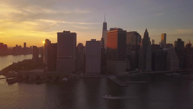 wider flying clockwise around downtown Manhattan at sunset