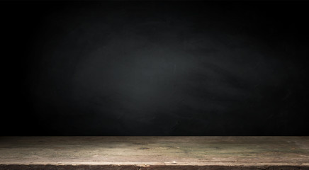 Old wood table top with smoke in the dark background