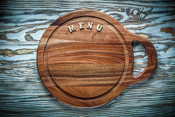 Carving board text on wooden surface