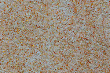 Colorful brown background of modern materials. background of threads with green and yellow spots.