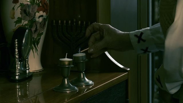Lighting Shabbat Candles. Hanukkah Candles Celebrating the Jewish Holiday.