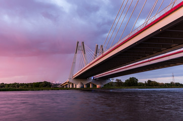 Cable stayed bridge, Krakow, Poland, during sunset over Vistula river