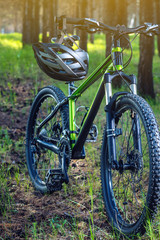 Sports helmet on a mountain bike in the Park. Concept protection during active and healthy lifestyle