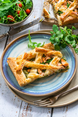 Salmon and broccoli tart with fresh leaf salad - high angle view