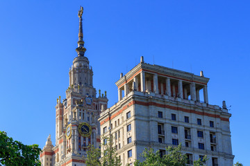 Obraz premium Towers of Lomonosov Moscow State University (MSU) on a blue sky background in sunny summer evening