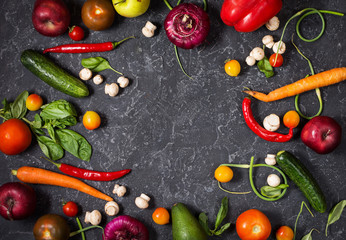 Raw organic vegetables with fresh ingredients for healthily cooking on vintage background, top view. Vegan or diet food concept