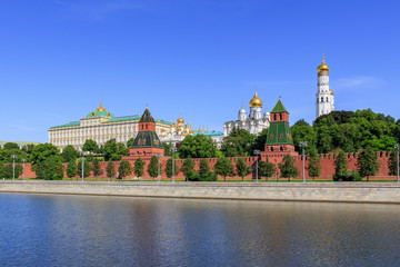 Moscow Kremlin on a Moskva river background against blue sky in sunny summer morning