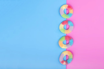 Jelly candies on blue pink background