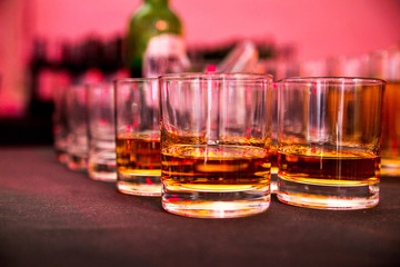 glasses of whiskey at a party
