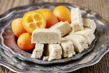 Sweet turkish dessert - halva and kumquat.