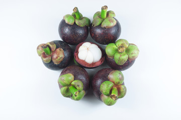 isolate mangosteen on white background, the tropical purple fruit in Thailand.