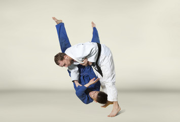 The two judokas fighters fighting men