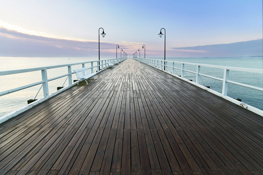 Fototapeta Wooden pier at sea shore, morning view, Gdynia Orlowo poland