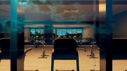 Seamlessly looping shot of luxury gym or fitness club with cardio equipment.
