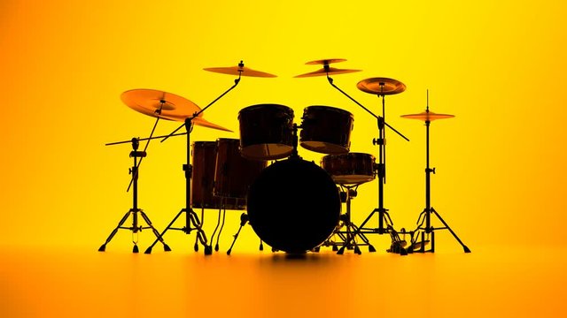 Details of drum kit on a bright yellow background. Percussion chrome hardware.