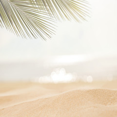 Sand with blurred Palm and tropical beach bokeh background, Summer vacation and travel concept. Copy space