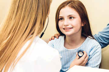 Doctor examining little girl with stethoscope in the hospital.healthcare and medicine