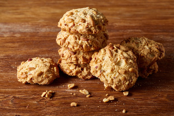 Bunch of chocolate biscuits on a rustic wooden background, close-up, selective focus.