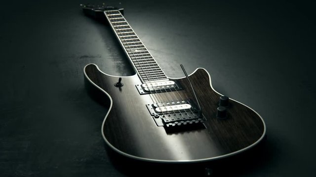 Modern six-string guitar on a concrete background. Contemporary music instrument