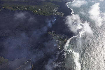 Fototapeta na wymiar Aerial view of lava flows from the eruption of Kilauea volcano in Hawaii flowing into the sea near Kapoho, May 2018