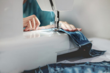 ailoring Process - Women's hands behind her sewing