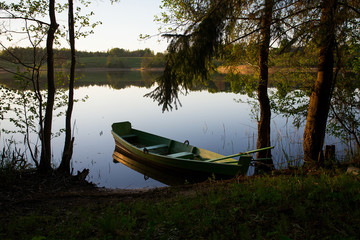 fishing boat in a calm lake water