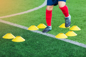 Kid soccer is jumping and jogging